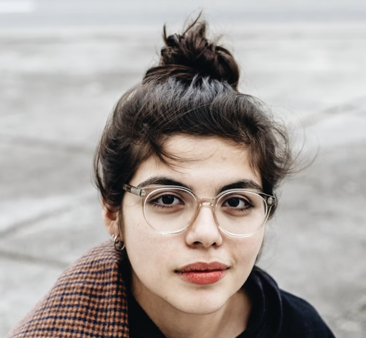 Young woman with glasses outdoors